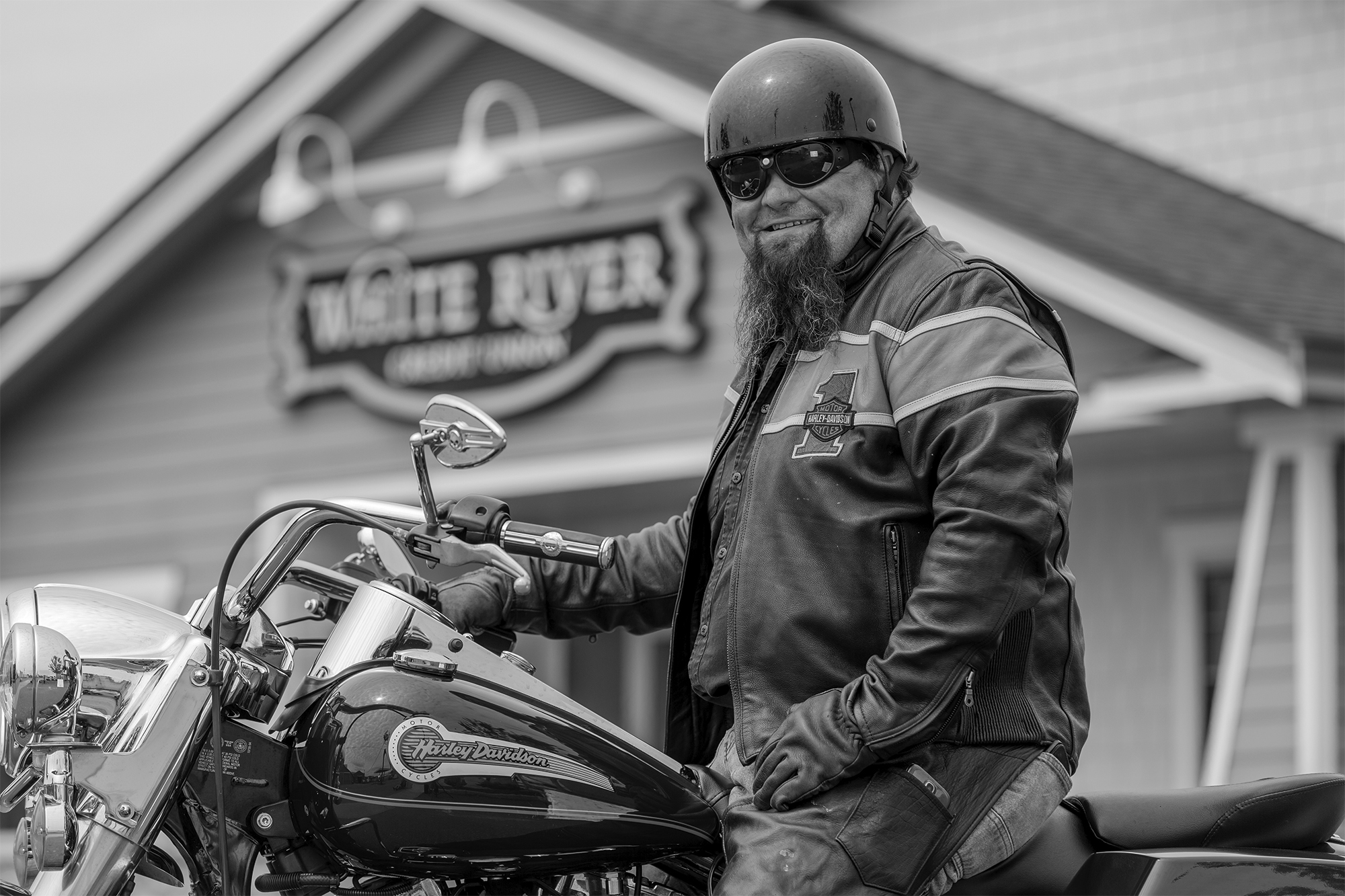 man on motorcycle in front of White River Credit Union