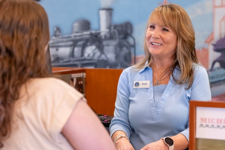 WRCU's helpful teller helping with member security
